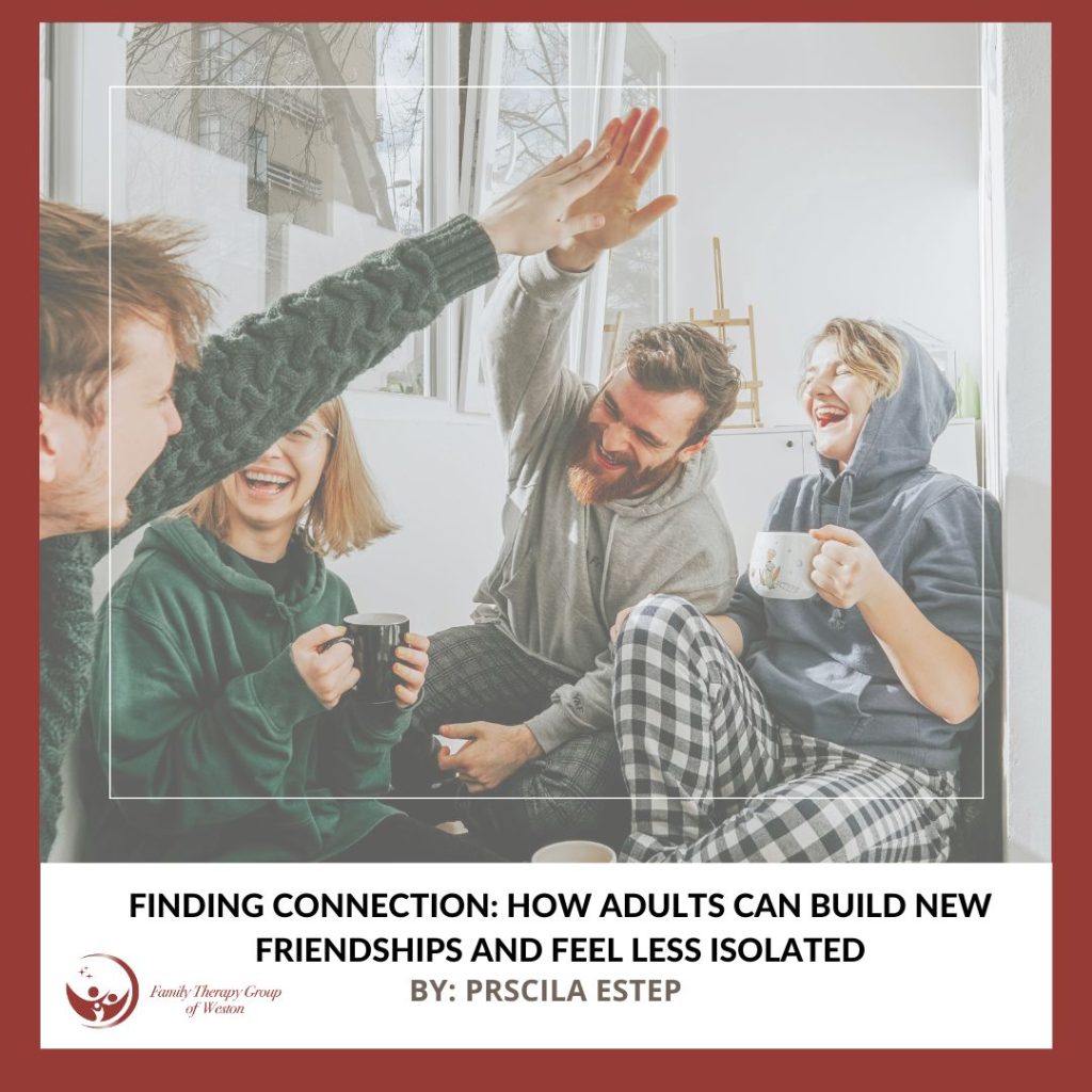 Four friends in a cozy room share a high-five and laugh, holding coffee mugs by a window.