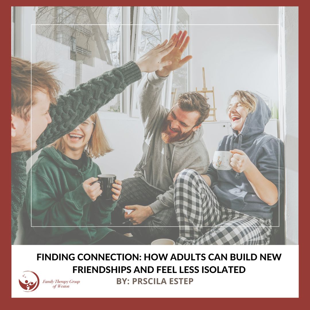 Four friends in a cozy room share a high-five and laugh, holding coffee mugs by a window.